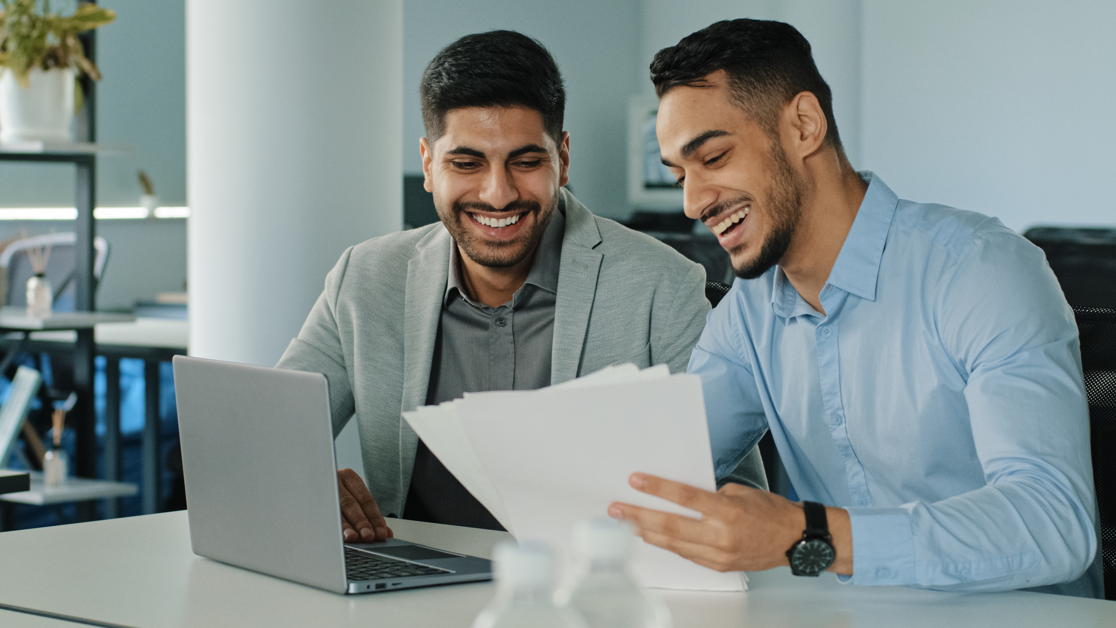 Smiling Young Colleagues Holding Paper Documents 2023 01 10 03 48 28 Utc
