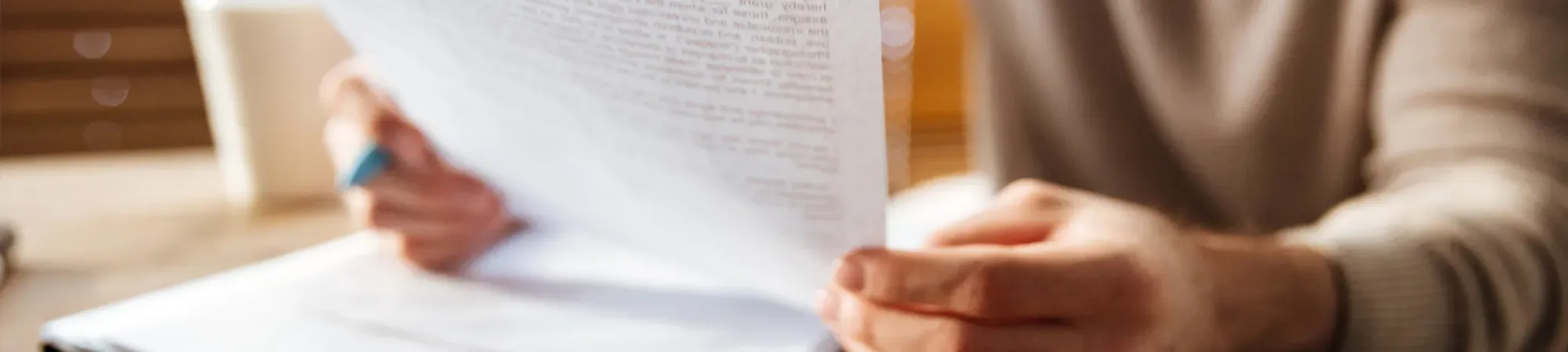 Generic image of a person looking at printed documents