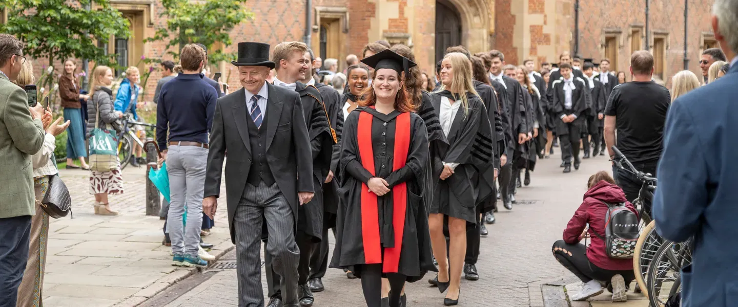 The Head Porter leads the procession toward Senate House on Graduation day