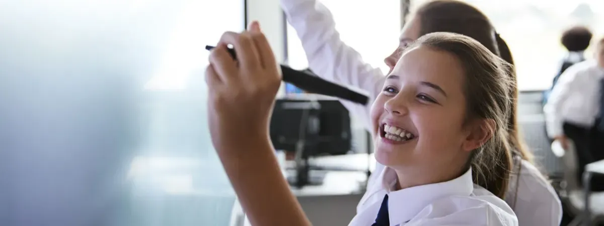 School pupil writing a maths assignment