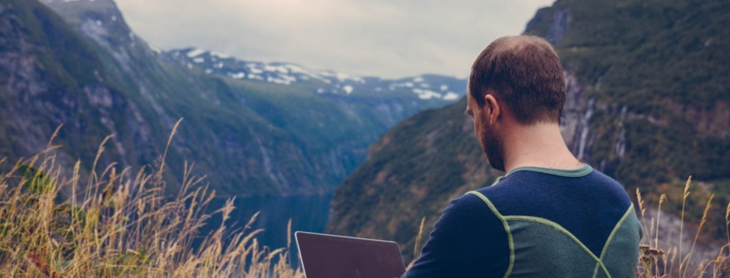 Man sitting outdoors clearing out his social media profiles