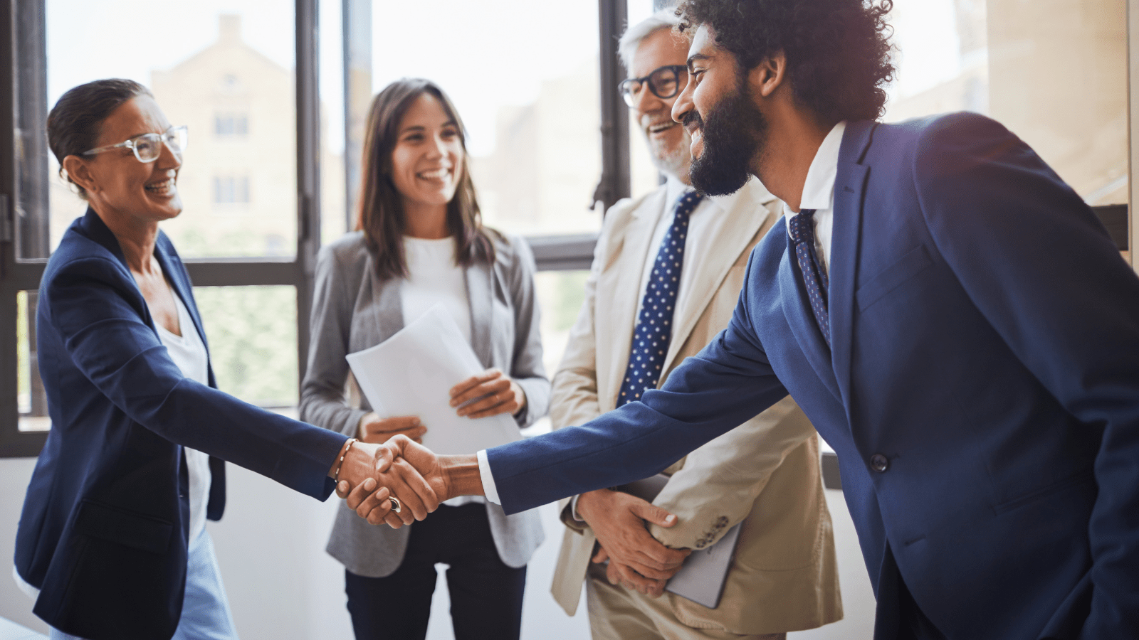 A Step5 consultant shaking hands with satisfied customers