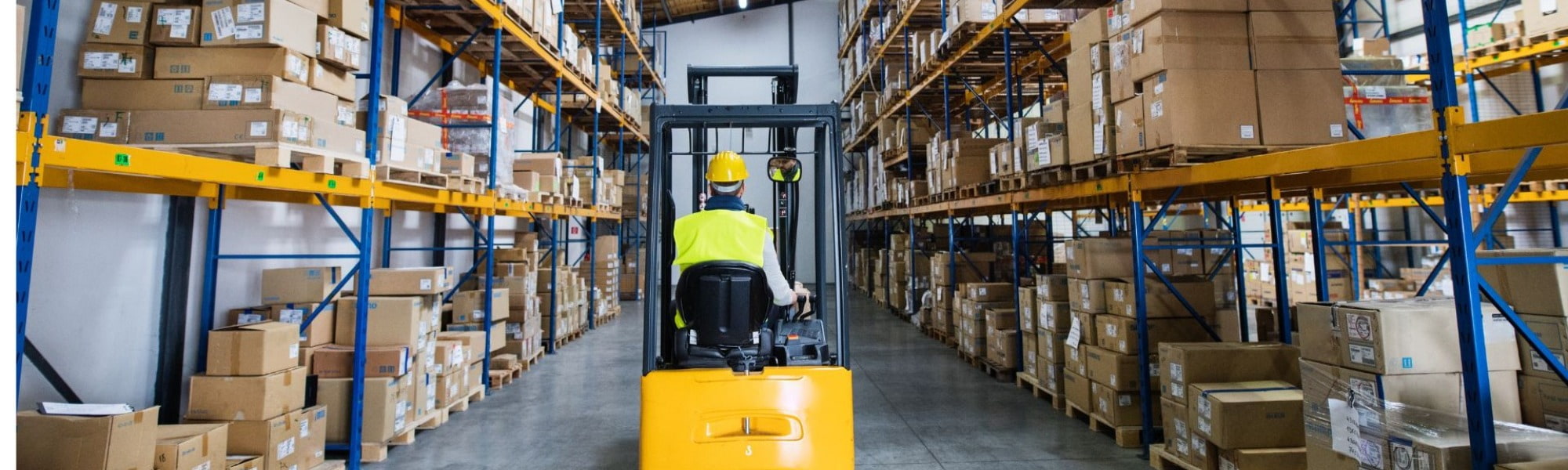 warehousing operator driving forklift