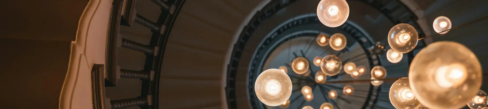 Spiral stair case with round light bulbs