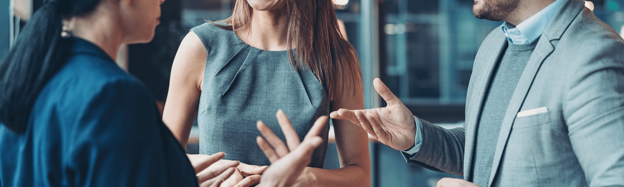 rofessionals networking at an industry event, exchanging business cards and ideas.