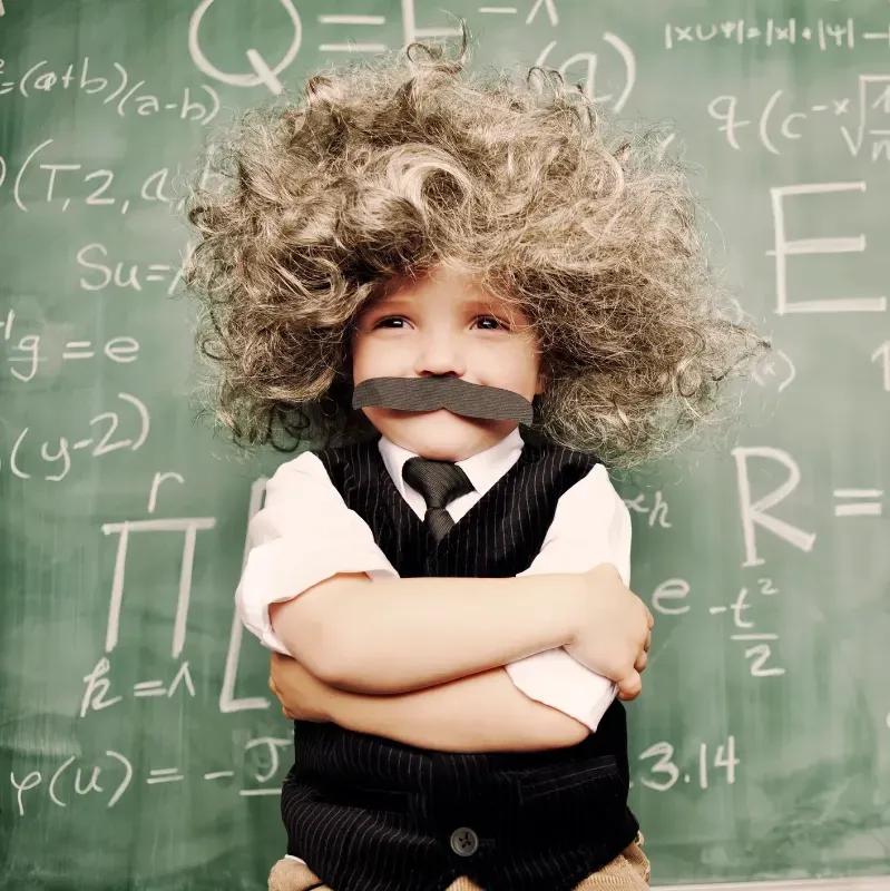 Little boy with moustache acting as a teacher