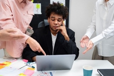 Man looking bored at work desk 