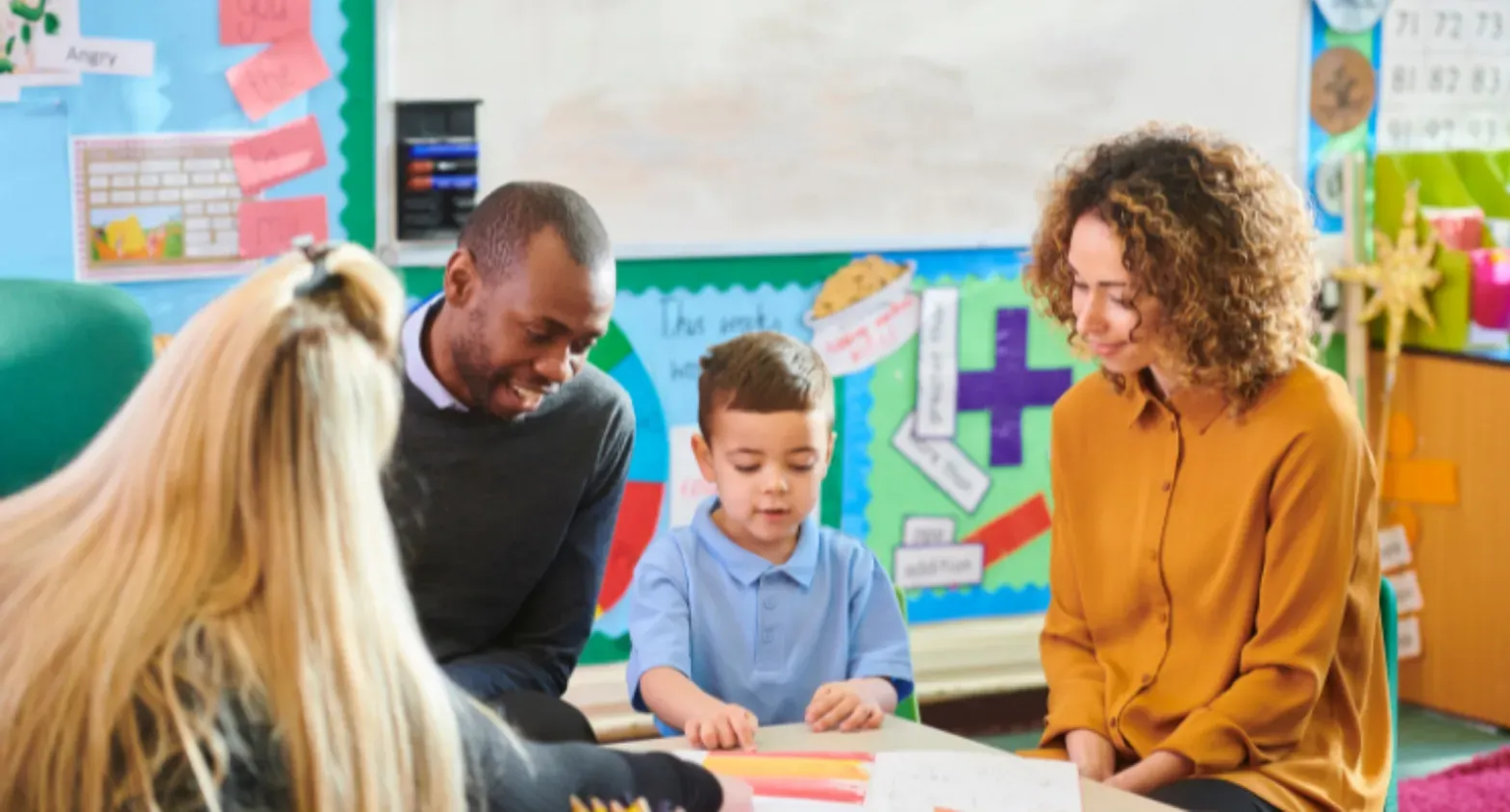 Three teachers working with children - iCan Teach UK