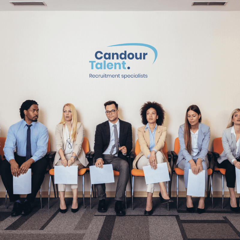 Candour Talent Recruitment Agency - Candidate Page. Main Photo. A group of candidates lined up, waiting to be interviewed, with their CVs placed underneath the Candour logo, representing the recruitment process and the agency's involvement in connecting candidates with opportunities.