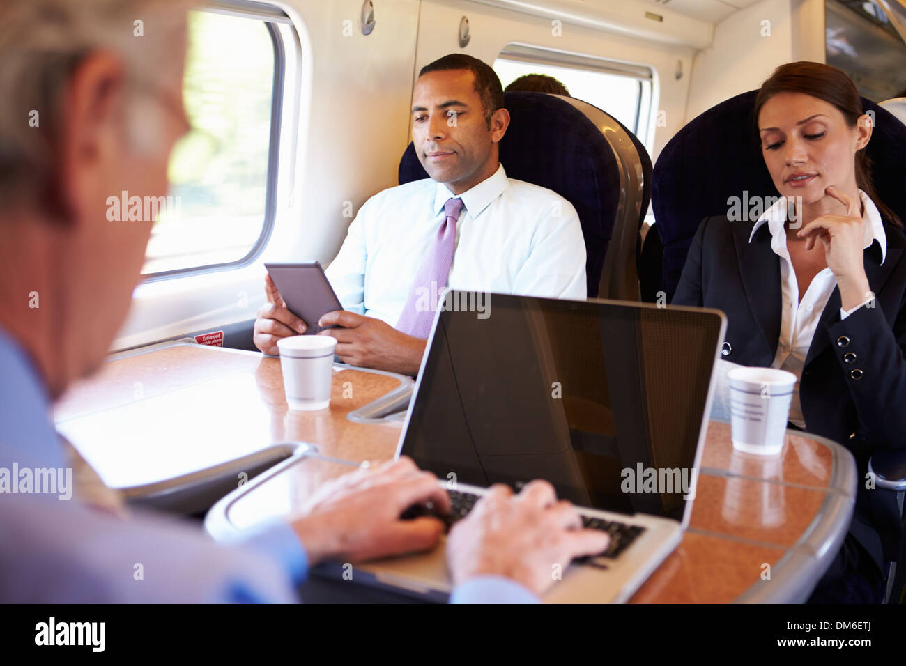 Businessman Commuting To Work On Train And Using Laptop Dm6 Etj
