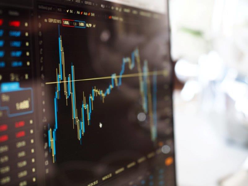 Canva   Blue And Yellow Graph On Stock Market Monitor