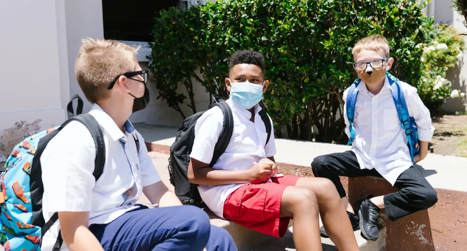 students with masks say outside