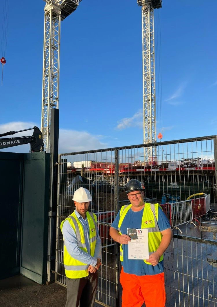 Scott and Dave with his award on site at West Quay Harbour