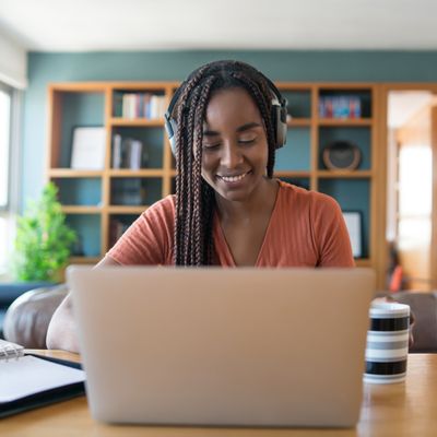 Portrait Woman Video Call With Laptop Headphones While Working From Home Concept