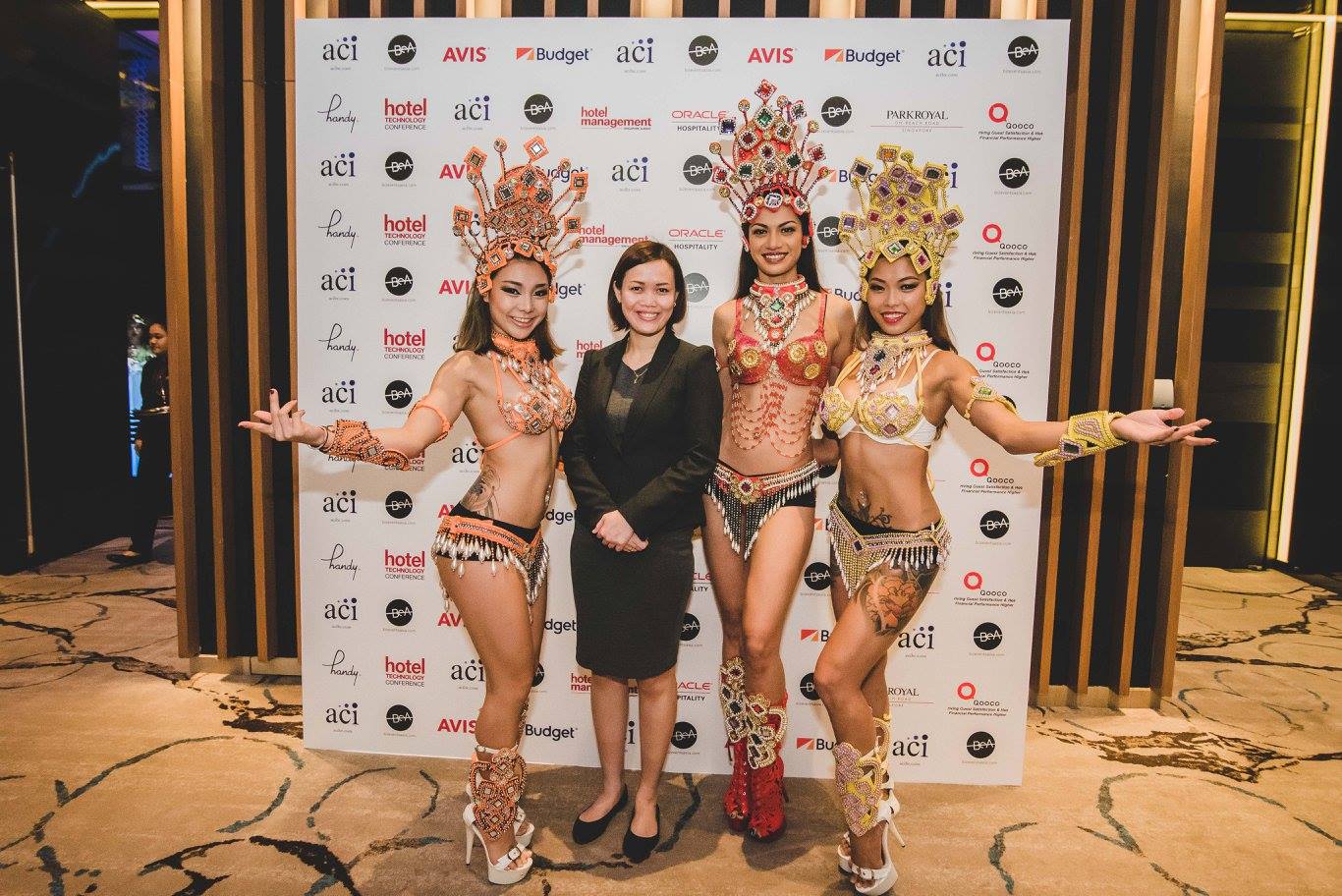 Hospitality networking woman with three Brazilian dancers