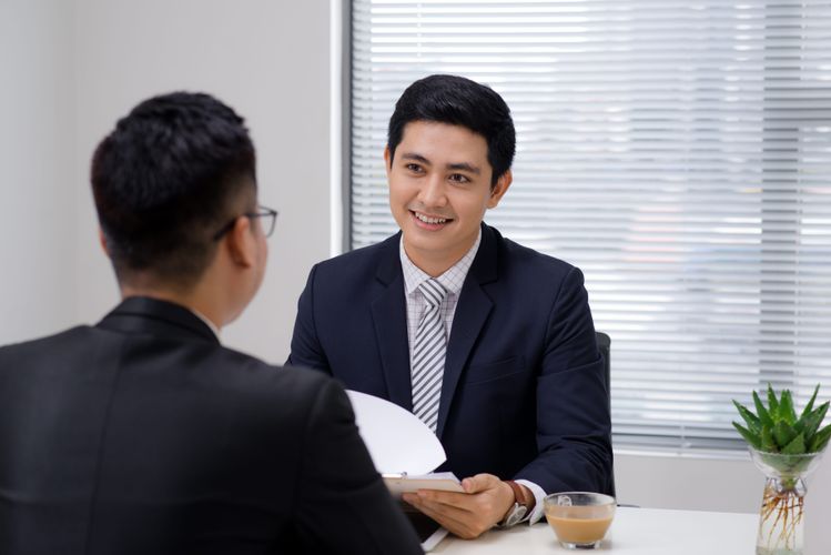 Job Interview Two Business Professionals Greeting New Colleague Min