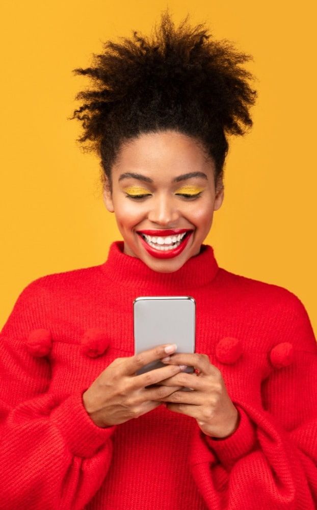 Smiling woman looking at a recruitment website on a mobile device