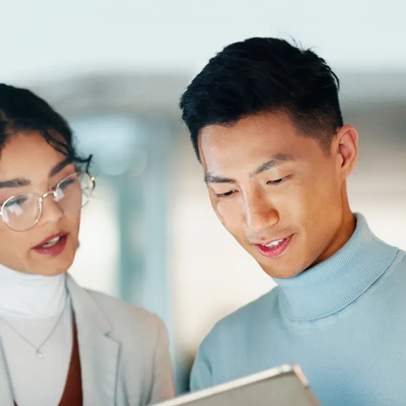 People looking at a tablet