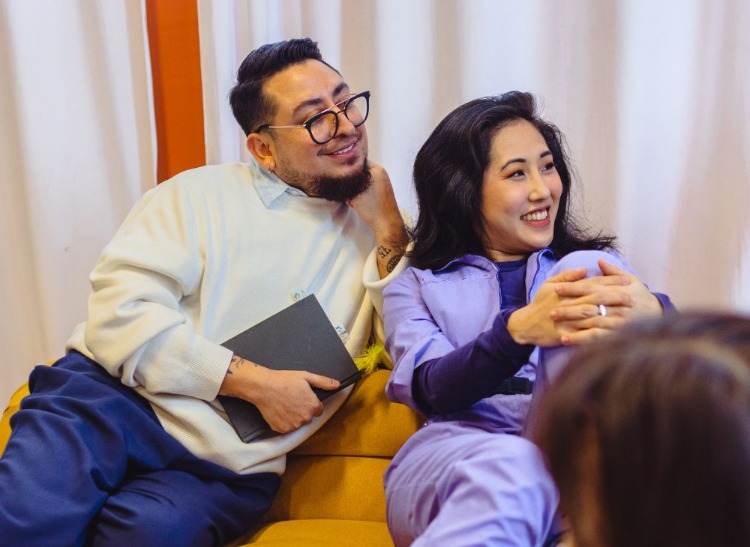 two people listening to a meeting