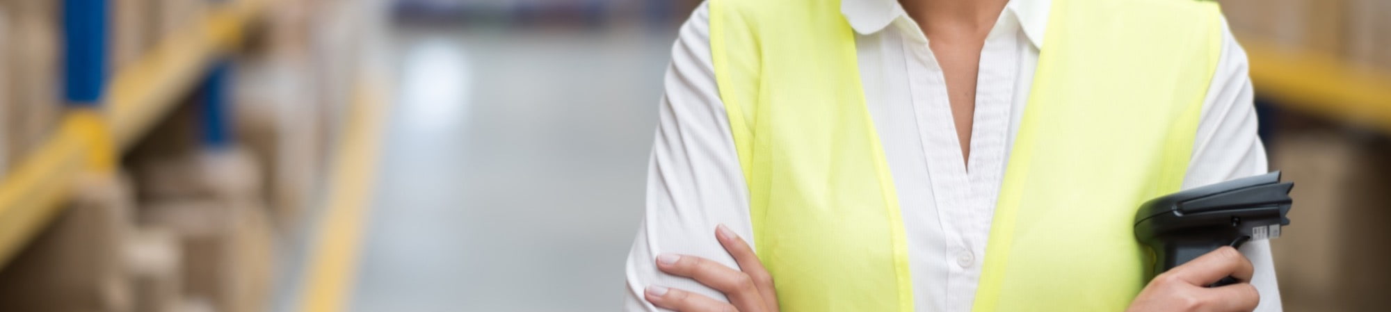 warehouse operative in a distribution centre scanning products 