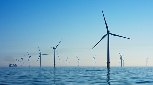 wind turbines at sea producing renewable energy