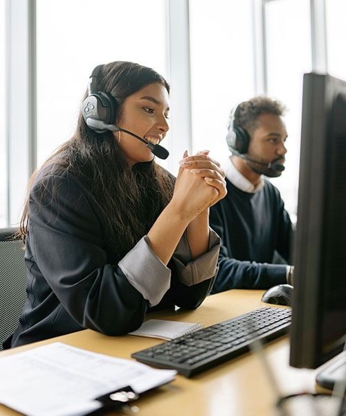 Employees on phone offering support to candidates