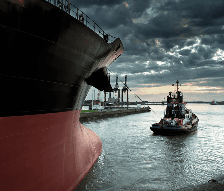 mobile image of large boat pulling small boat