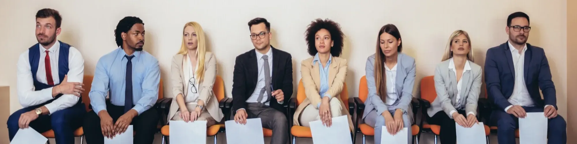 group of candidates waiting in lobby to be interviewed for new job with potential employer