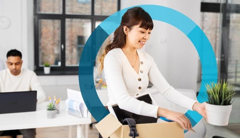 Woman smiling packing possessions