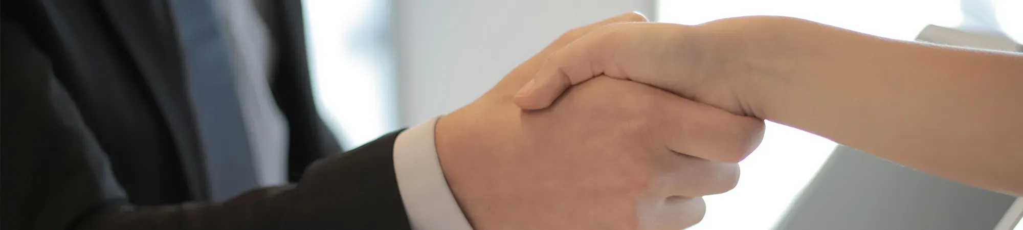 Generic image of two people shaking hands
