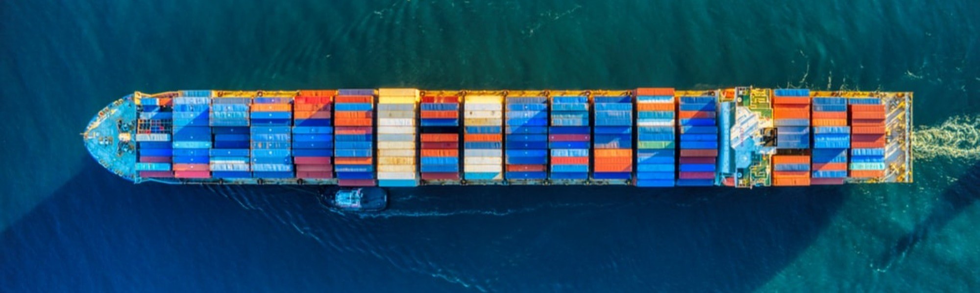 Colourful shipping containers stacked on a ship