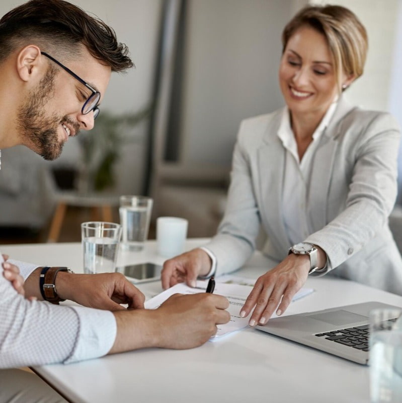 Man signing insurance papers