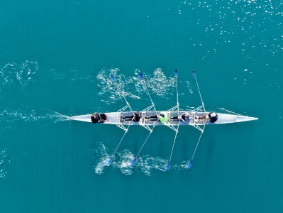 Boat with rowers in on river