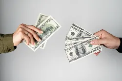 Hands holding cash