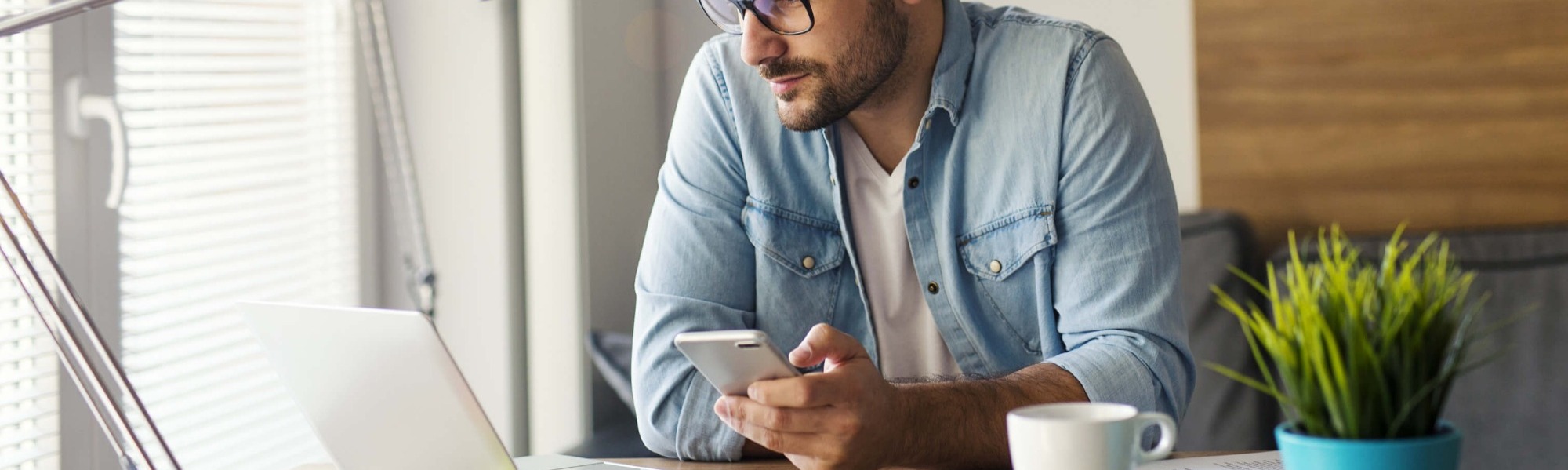 Jobseeker looking for new career opportunities on phone and computer