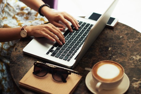 Woman typing on laptop