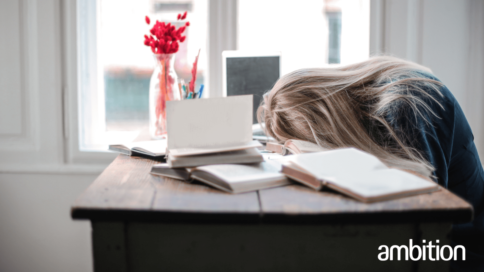 Lady sleeping on desk