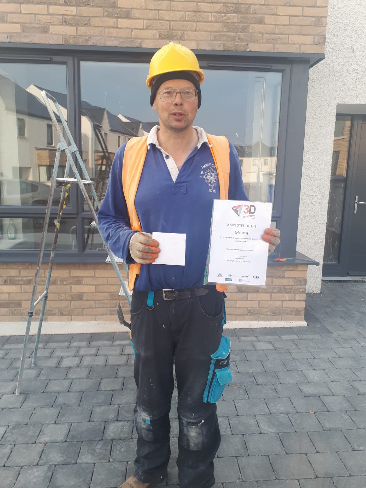 Alfie with his award on site