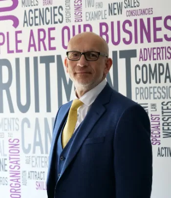 Lee Sweeney Executive Director at Sharp consultancy, wearing a navy suit