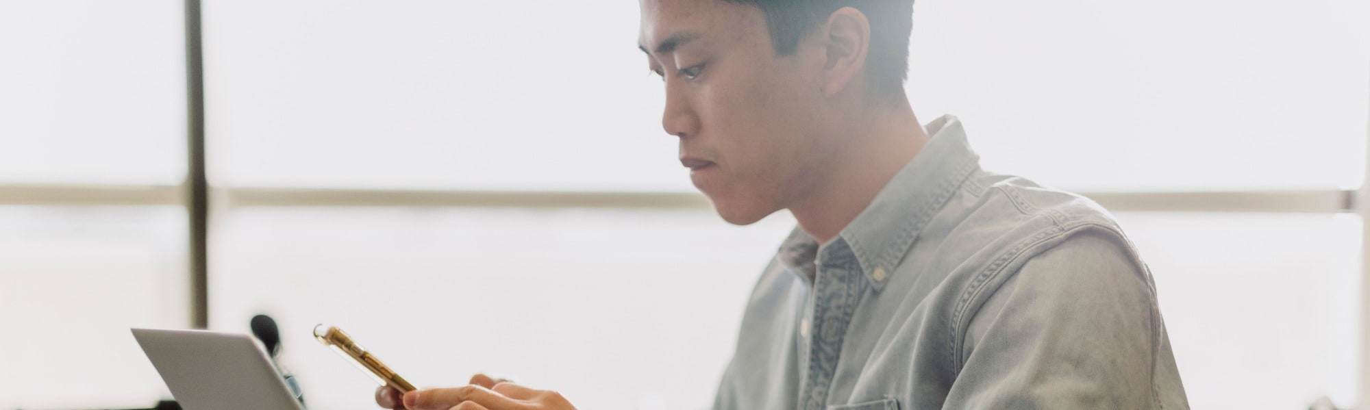 A finance and accountancy professional sits at a desk in an office