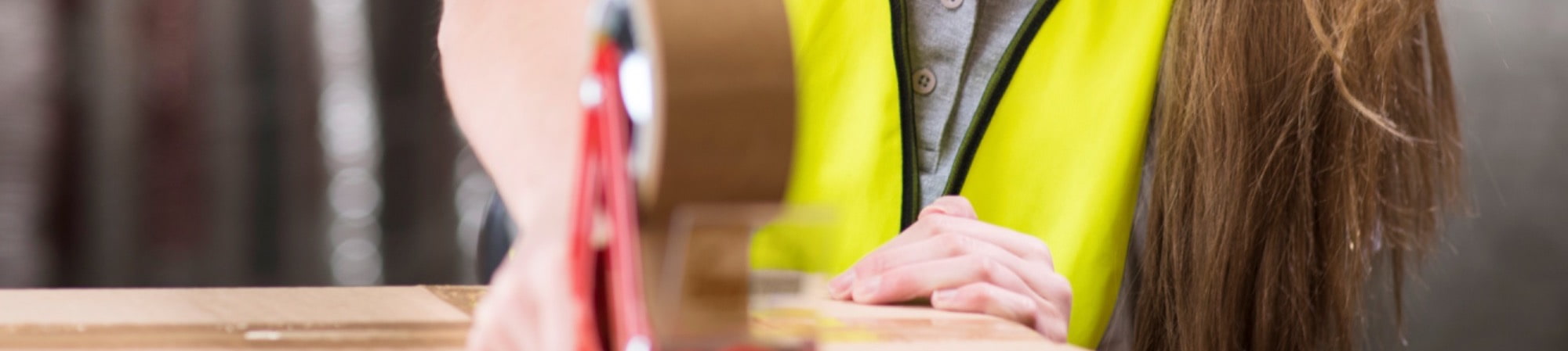 warehouse operative packing and picking order wearing MAK Jobs uniform in the warehouse in Daventry 