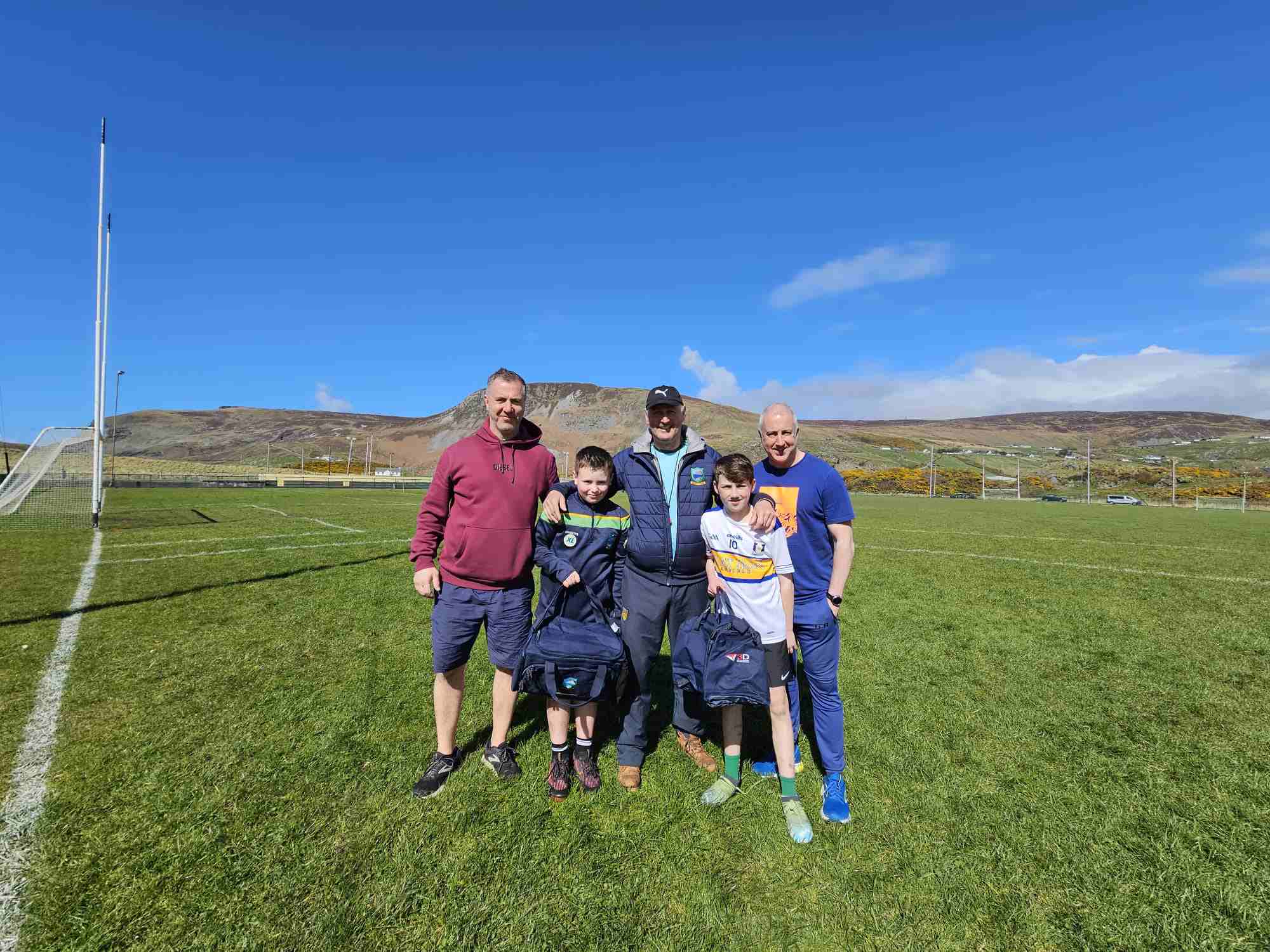 Michael Byrne, his son Cillian, coach Paddy Hegarty, Jamie Cunningham and his father Conal