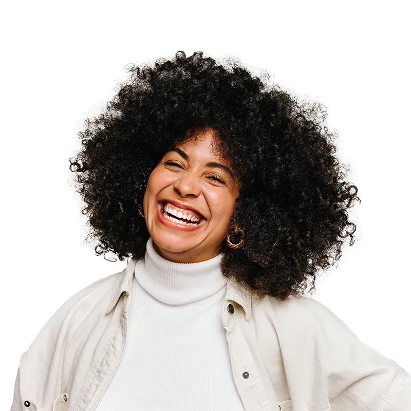 Woman with dark hair looking up and smiling