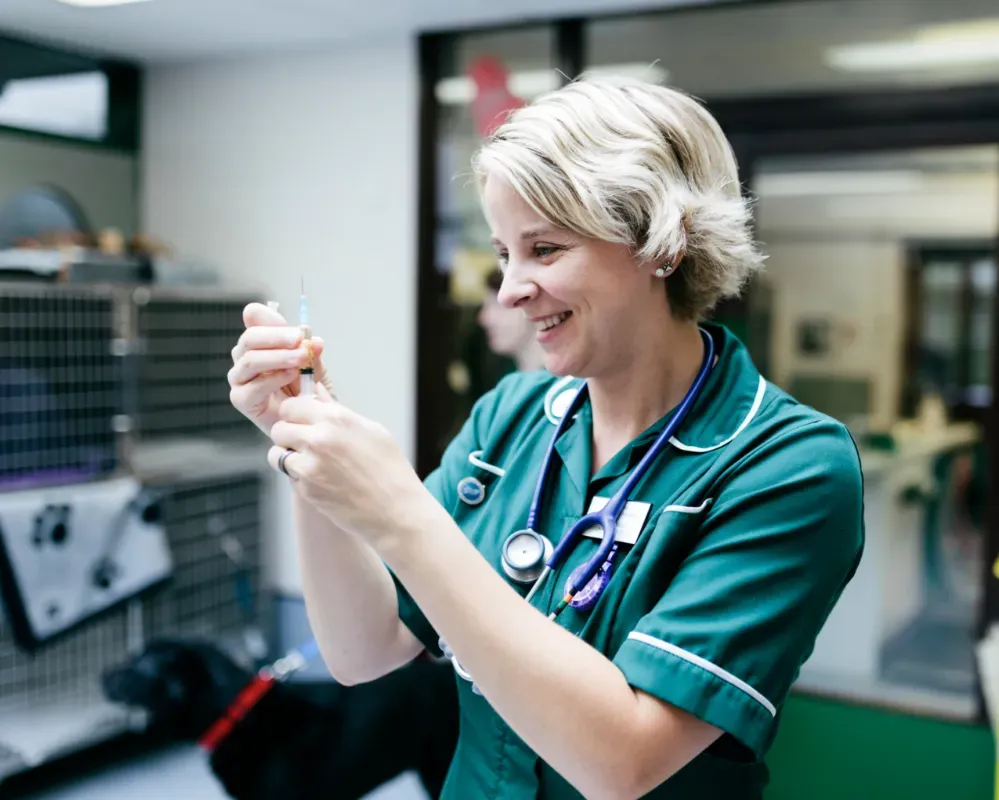 nurse preparing injection needle