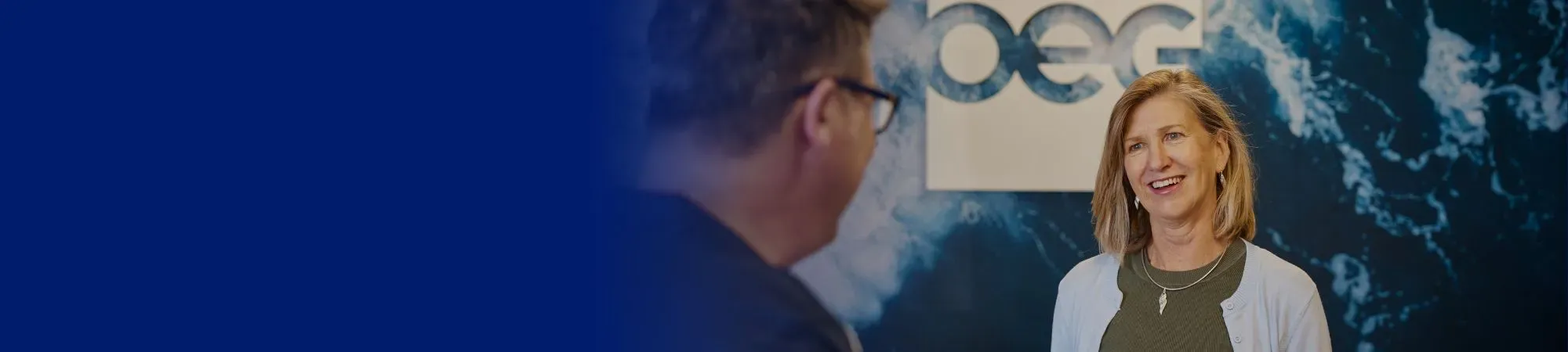 OEG receptionist welcoming a fellow colleague.