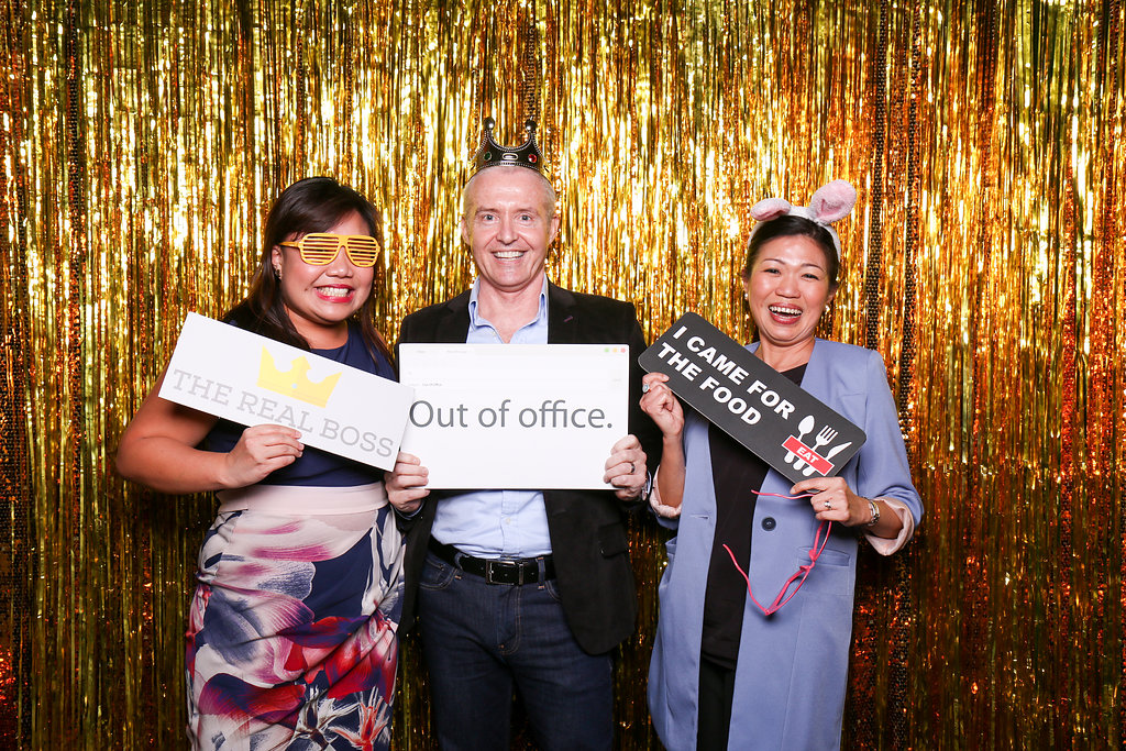 Photobooth photo with man and two women