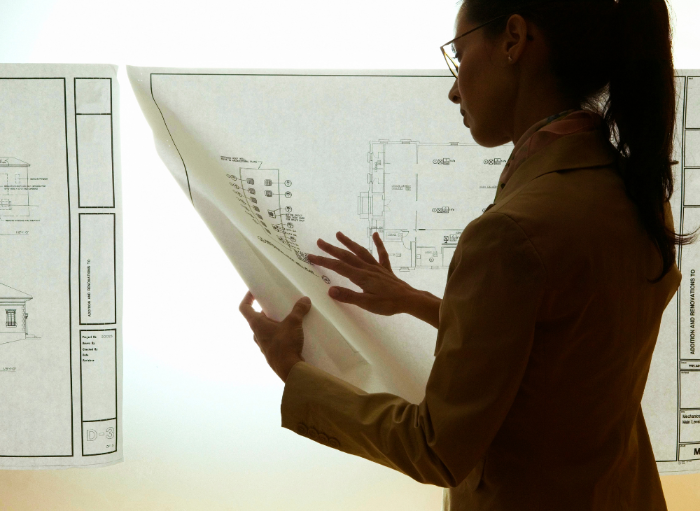 female architect looking at drawings