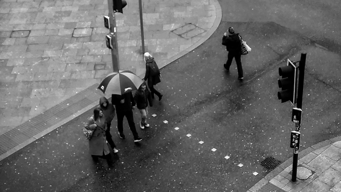 Commuters Crossing The Road In Uk