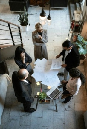 People around a table discussing