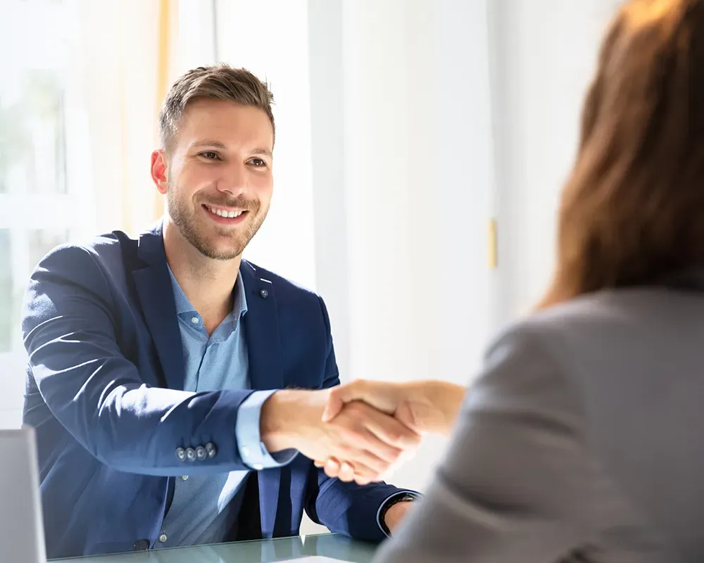 professional shaking hands with recruiter